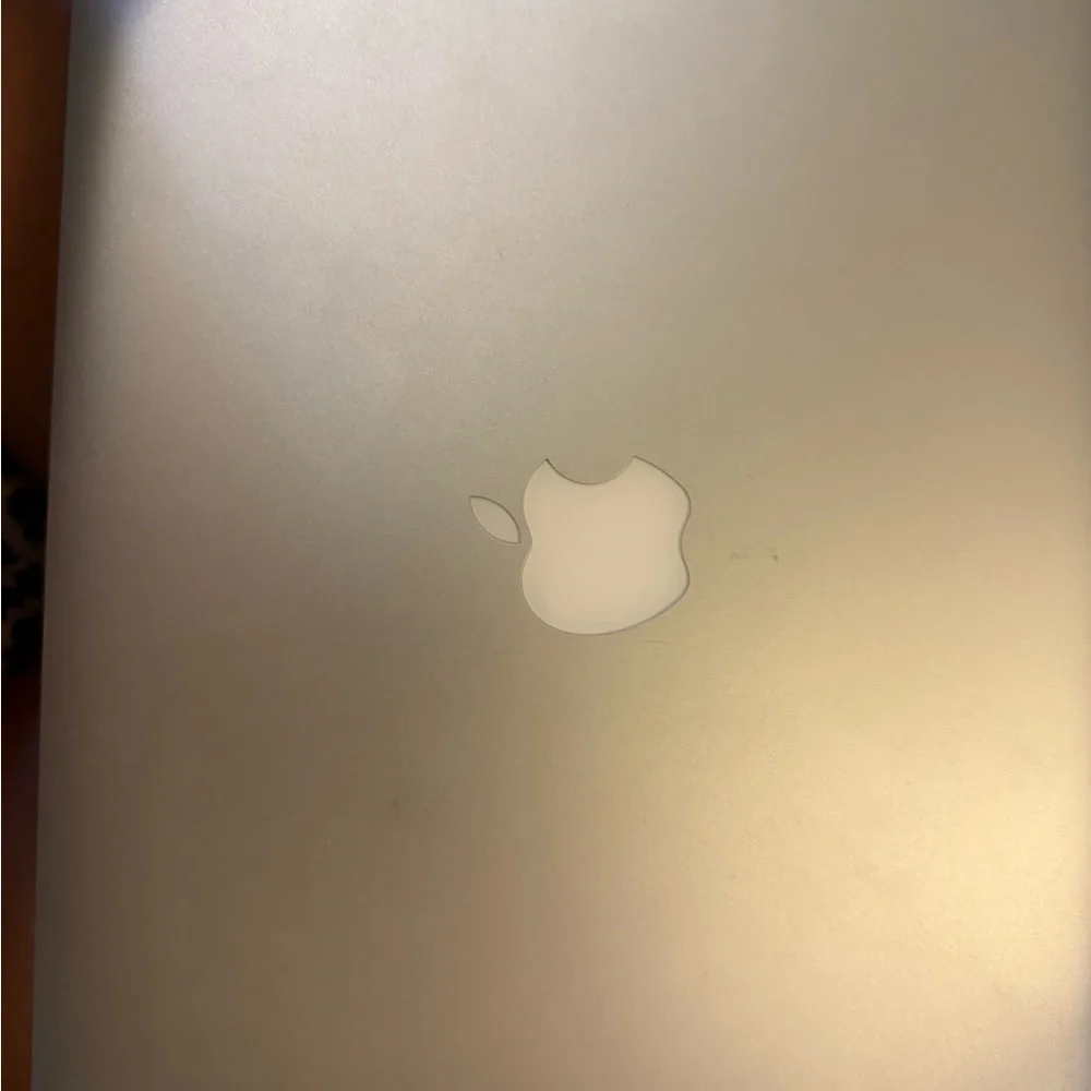 Apple Silver MacBook Laptop with Minimalist Design and Backlit Keyboard